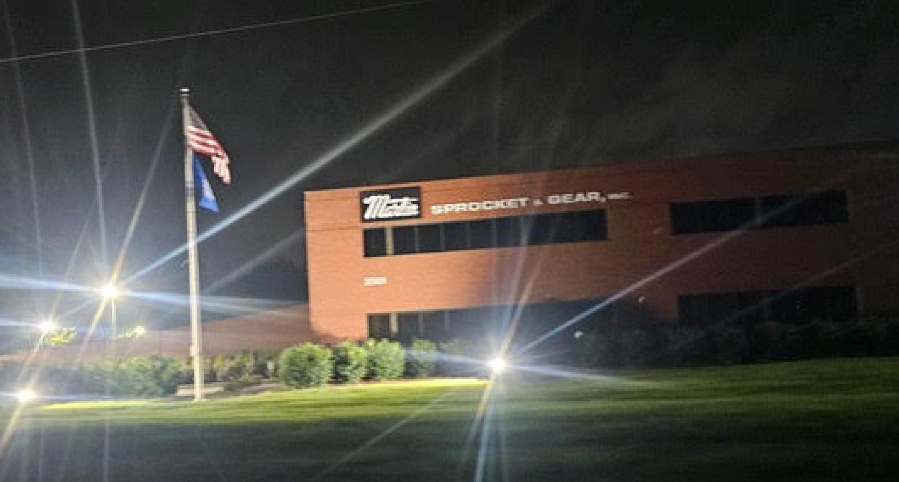 Martin Sprocket & Gear facility after LED upgrade-uniform lighting across warehouse façade.”